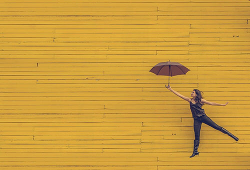 A girl with an umbrella.