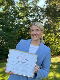 Young woman holding certificate 