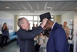 Prince Johnson receiving his doctoral hat